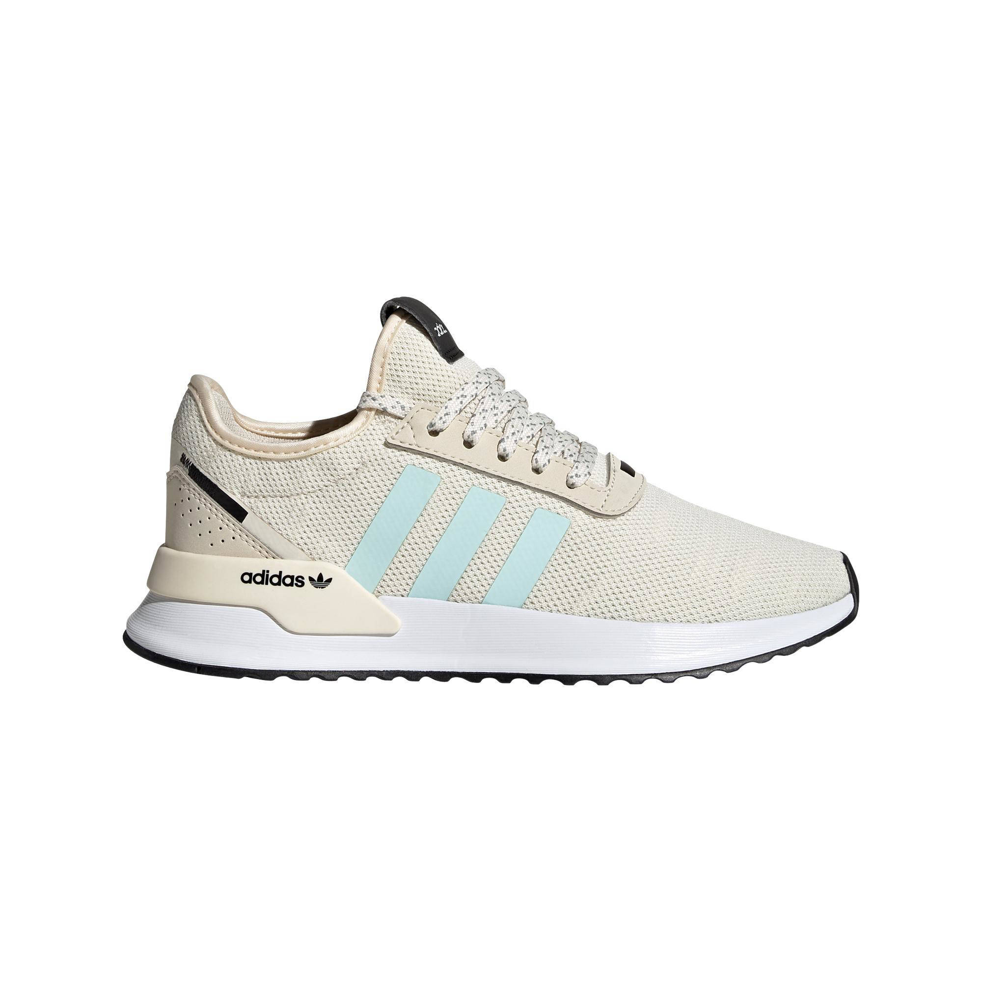 beige and white adidas
