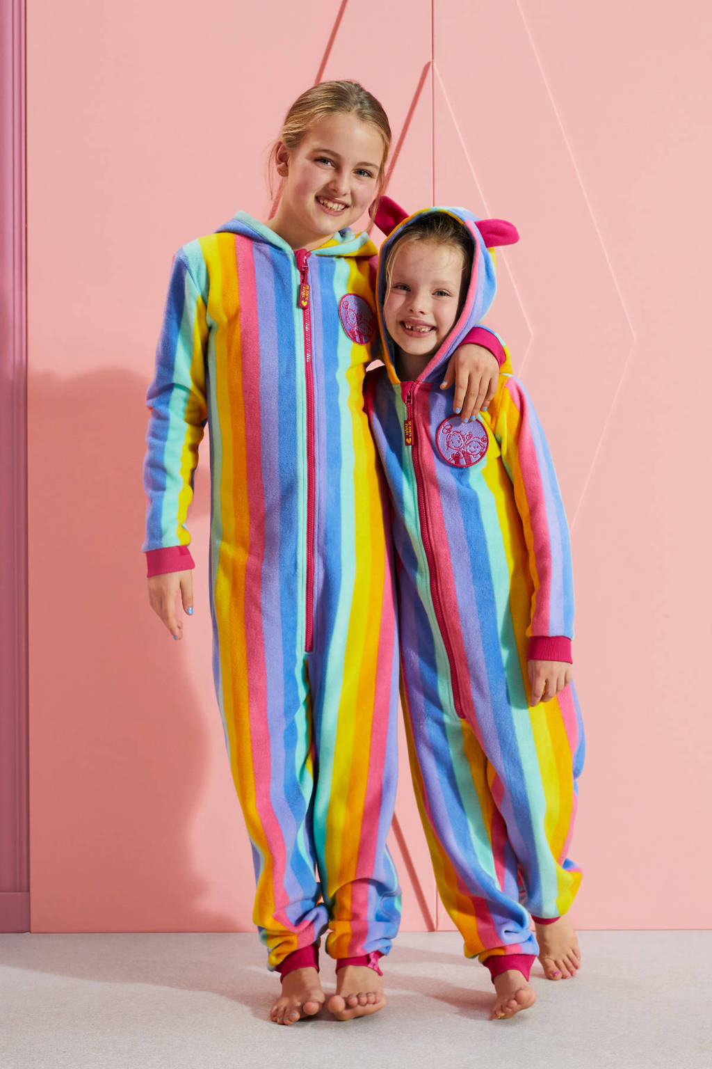 Vernauwd officieel Gecomprimeerd De Zoete Zusjes onesie met regenboog print roze/geel/blauw | wehkamp