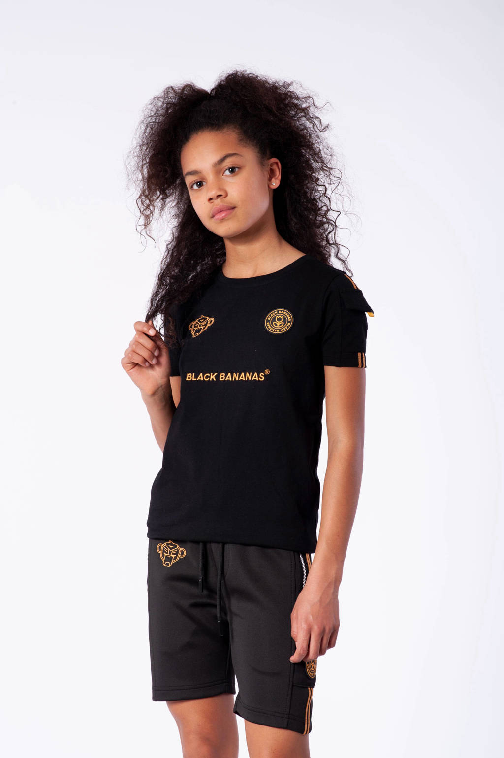 De vreemdeling haak Betsy Trotwood BLACK BANANAS unisex T-shirt zwart/oranje | wehkamp