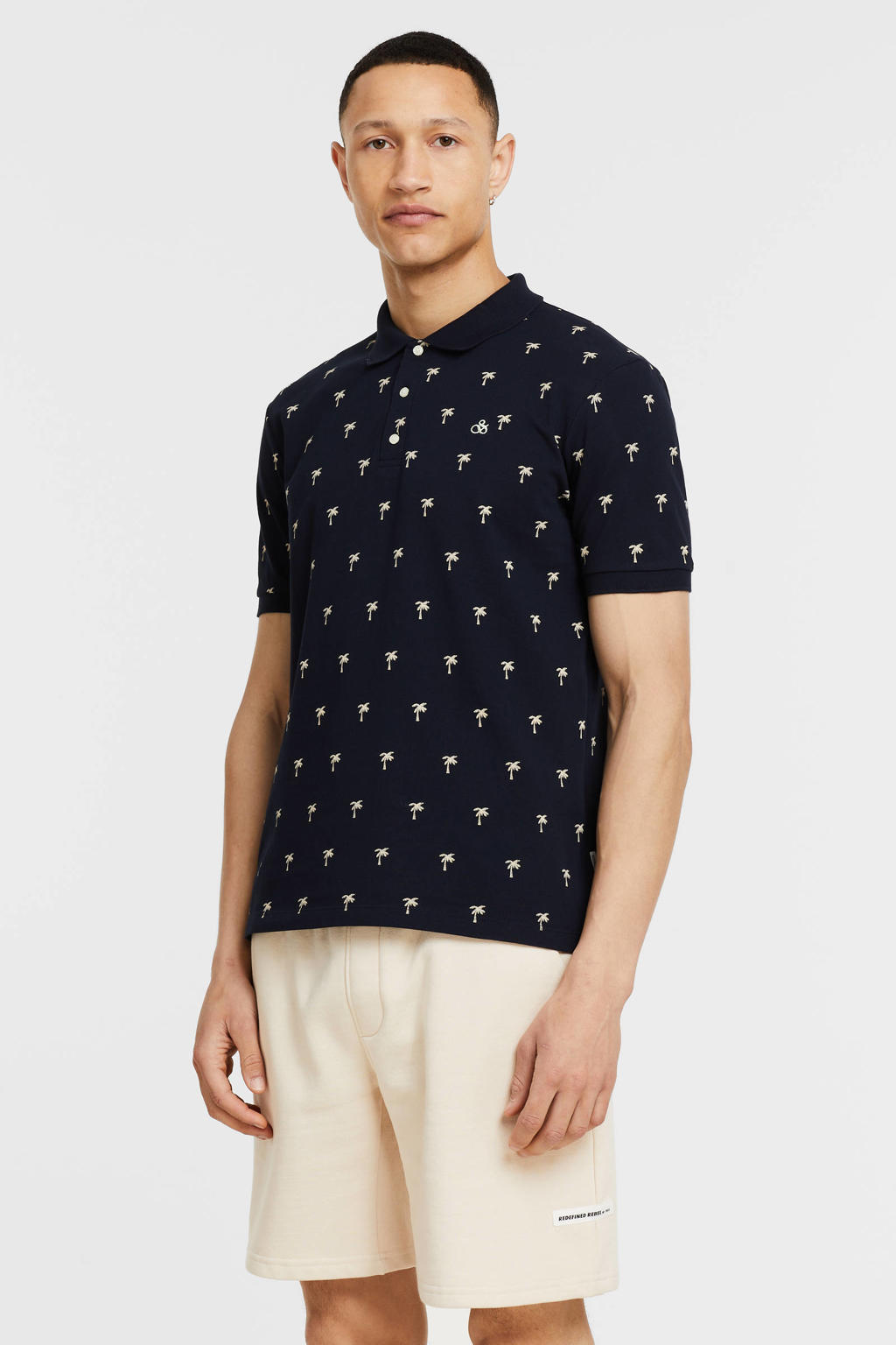 Donkerblauwe heren Scotch & Soda polo van biologisch katoen met all over print, korte mouwen en klassieke kraag