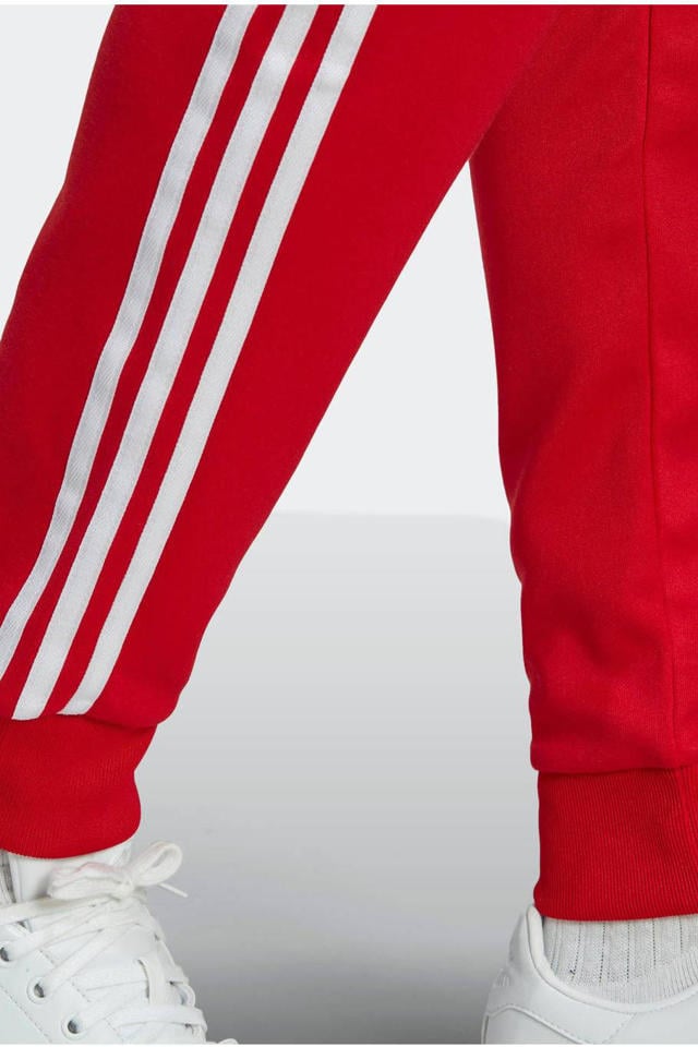 Geweldig Niet modieus Reinig de vloer adidas Originals Superstar trainingsbroek rood | wehkamp