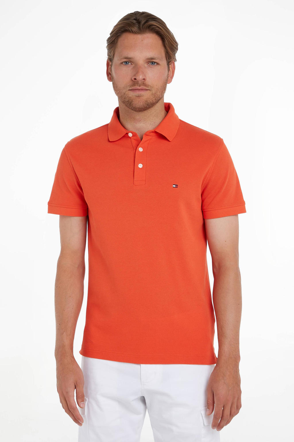 Oranje heren Tommy Hilfiger slim fit polo van duurzaam stretchkatoen met logo dessin, korte mouwen en klassieke kraag