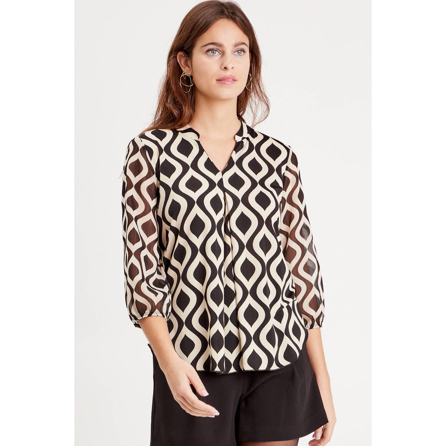 Cache semi-transparante blousetop met all over print zwart ecru