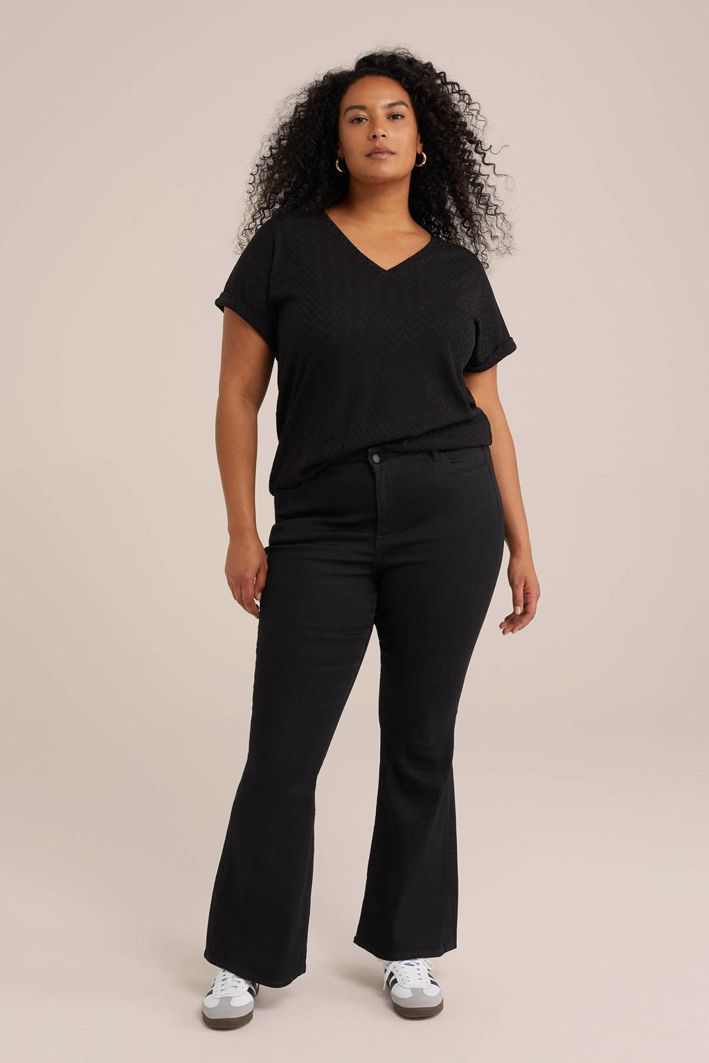 Zwarte dames WE Fashion top patroon van polyester met effen, korte mouwen en V-hals