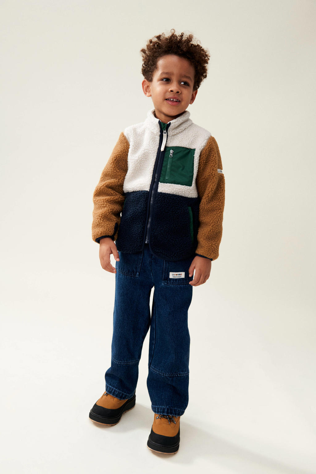 Blauw, bruin en witte jongens Liewood teddy tussenjas Nolan met meerkleurige print, lange mouwen, opstaande kraag en ritssluiting