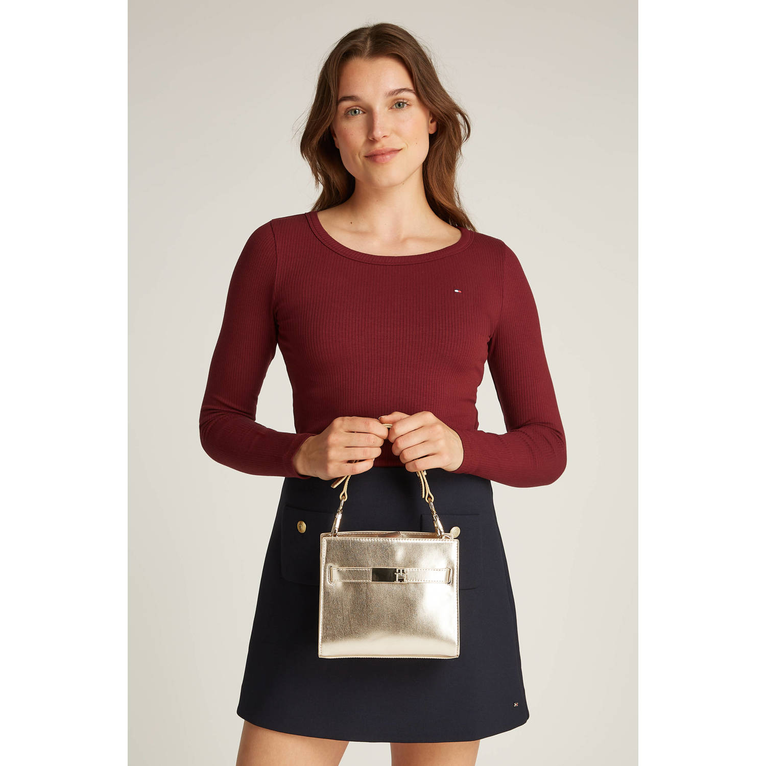 Tommy Hilfiger mini handtas TH Heritage goudkleurig