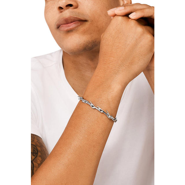 Zilverkleurige gourmet schakelarmband met vlechtstructuur Zilverkleurige gourmet schakelarmband met vlechtstructuur