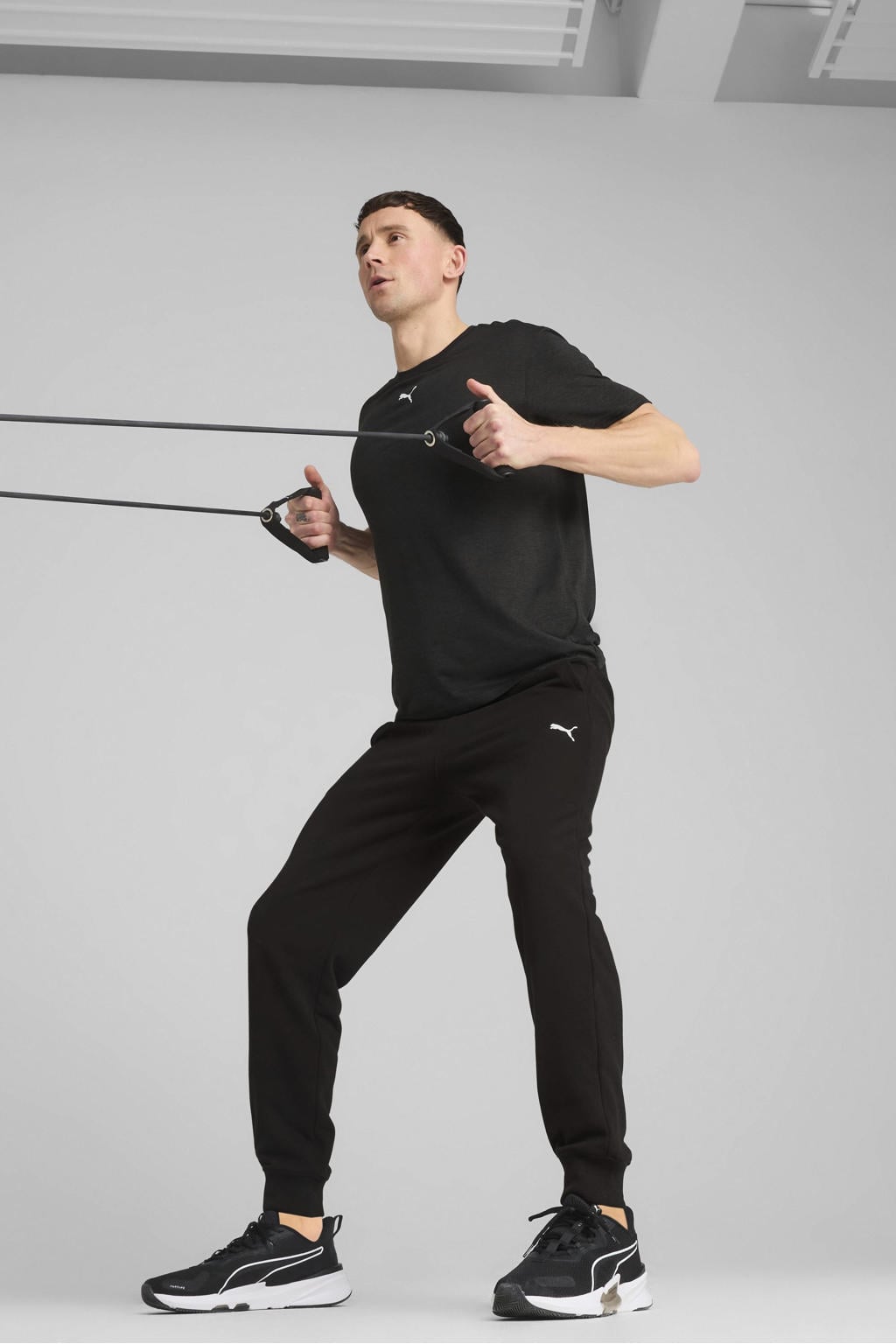 Zwarte heren Puma joggingbroek TAD Essential van katoen met regular fit, elastische tailleband met koord en effen