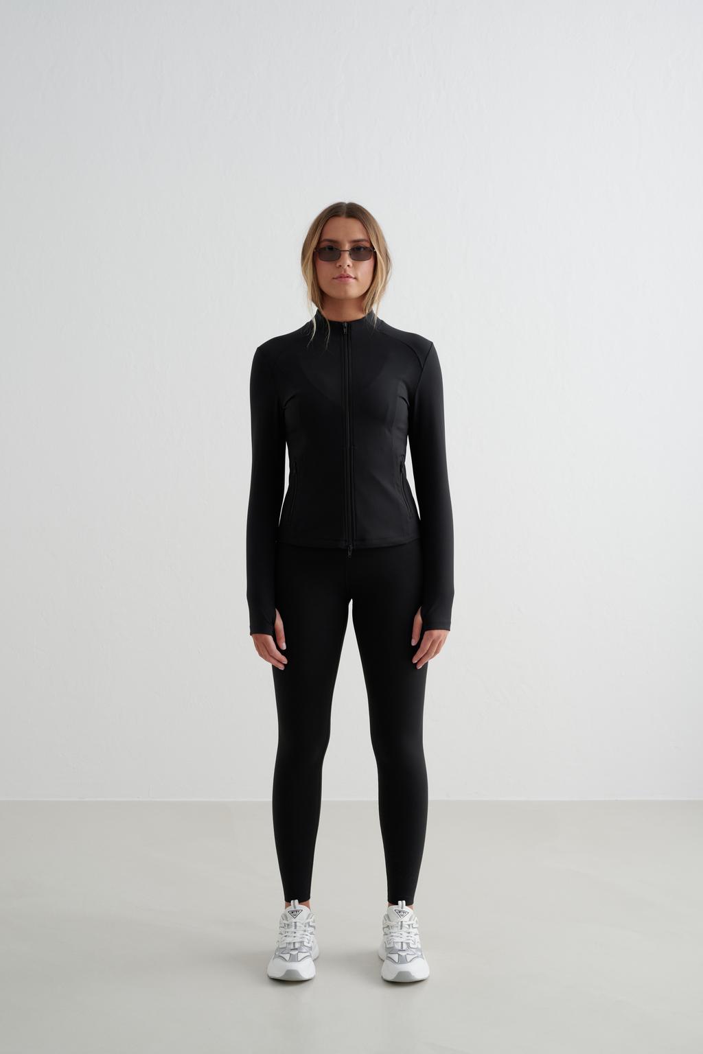 Zwarte dames Aim'n sportjack Sense van polyester met lange mouwen, opstaande kraag en 2-way rits