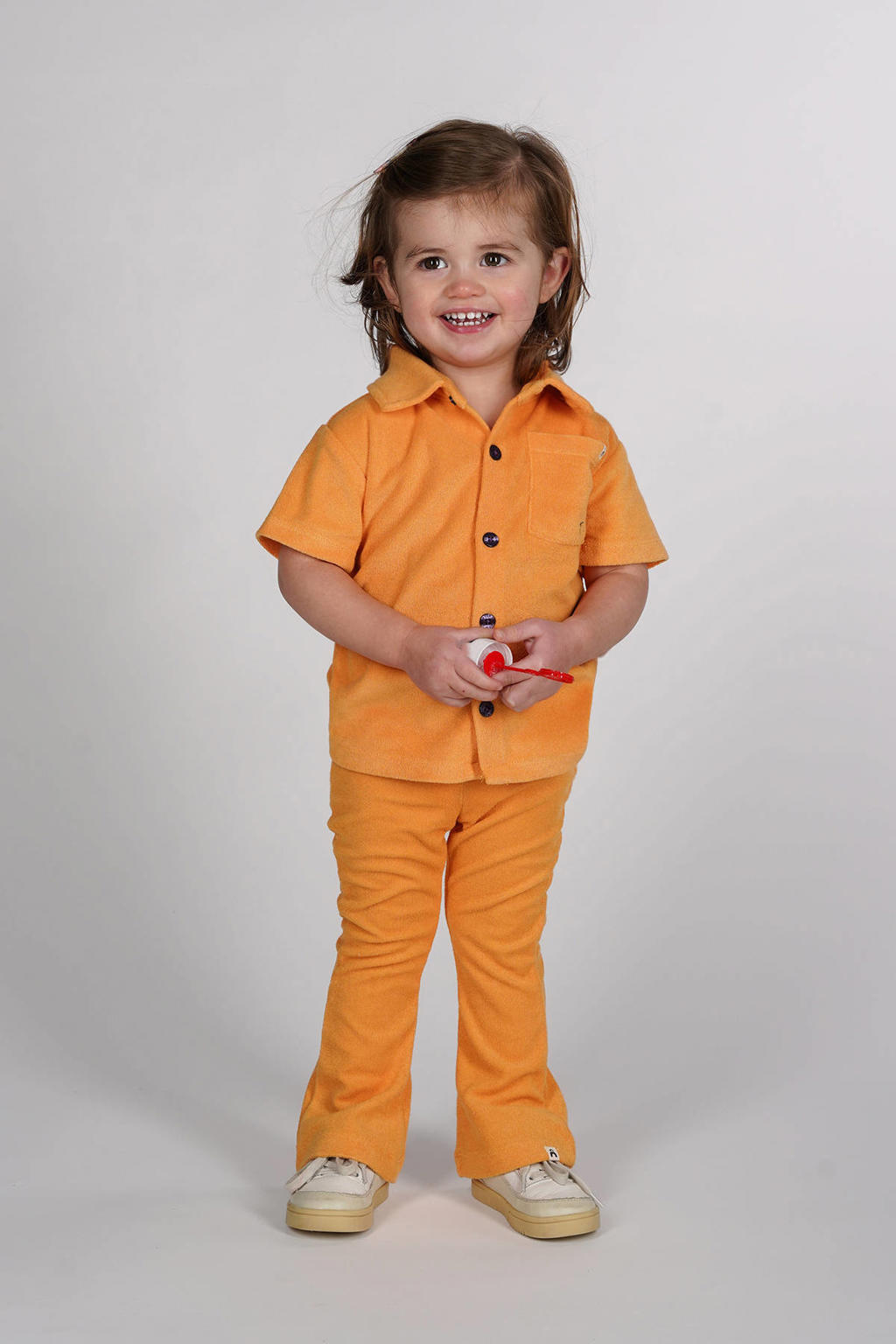 Oranje meisjes The New Chapter polo van badstof met effen, korte mouwen en knoopsluiting