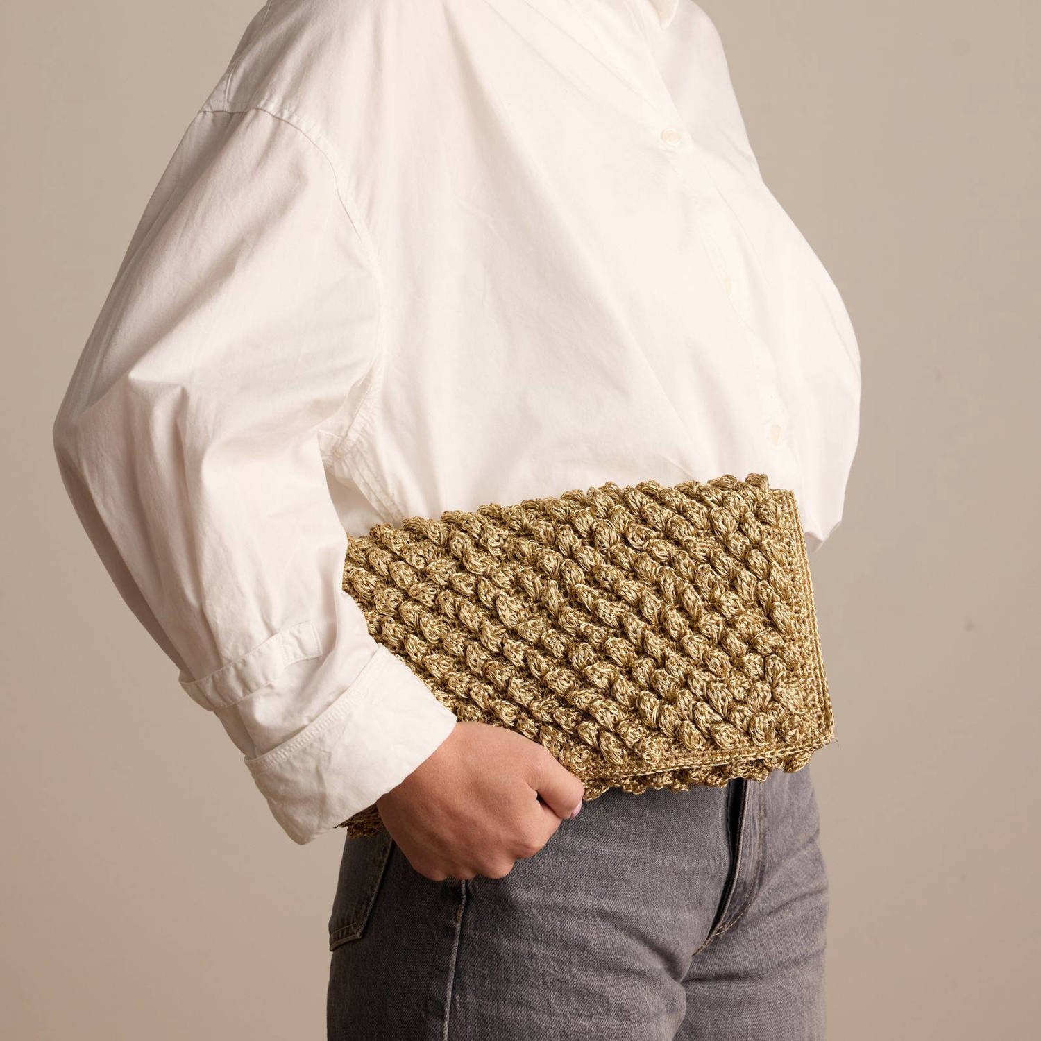 Manfield clutch goudkleurig