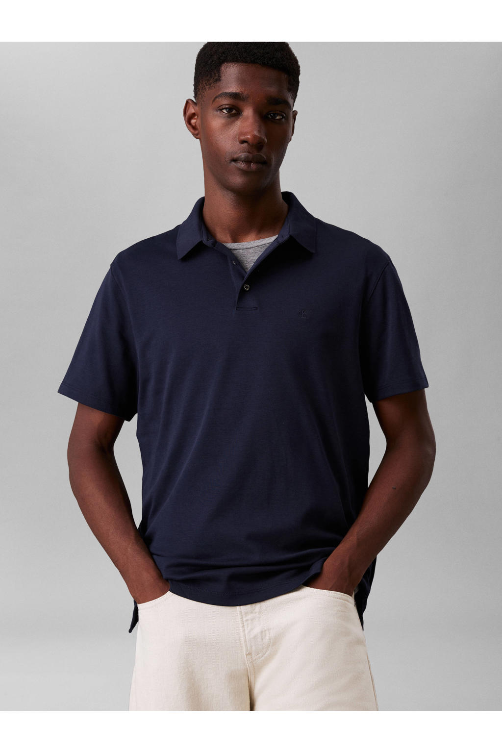 Blauwe heren Calvin Klein regular polo van katoen met effen, korte mouwen en knoopsluiting