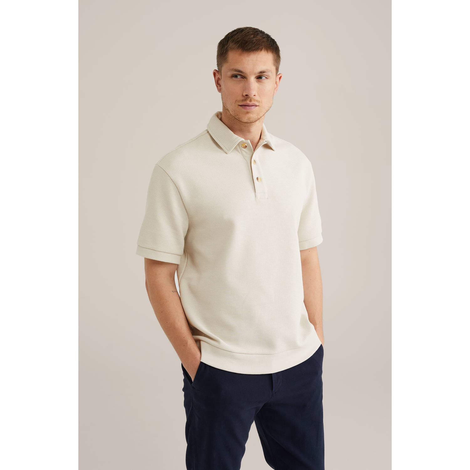WE Fashion loose polo met textuur beige