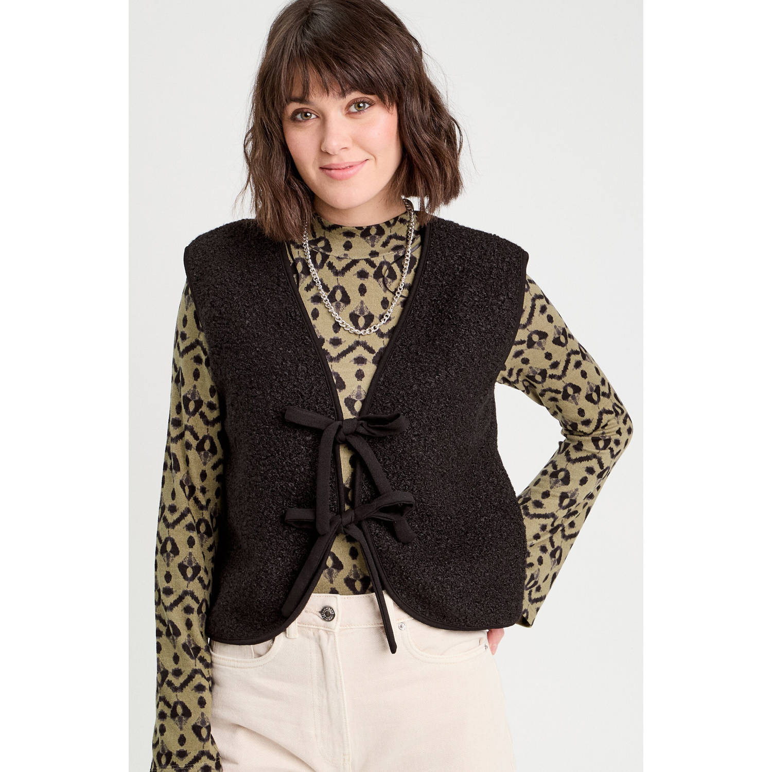 Cache teddy gilet zwart