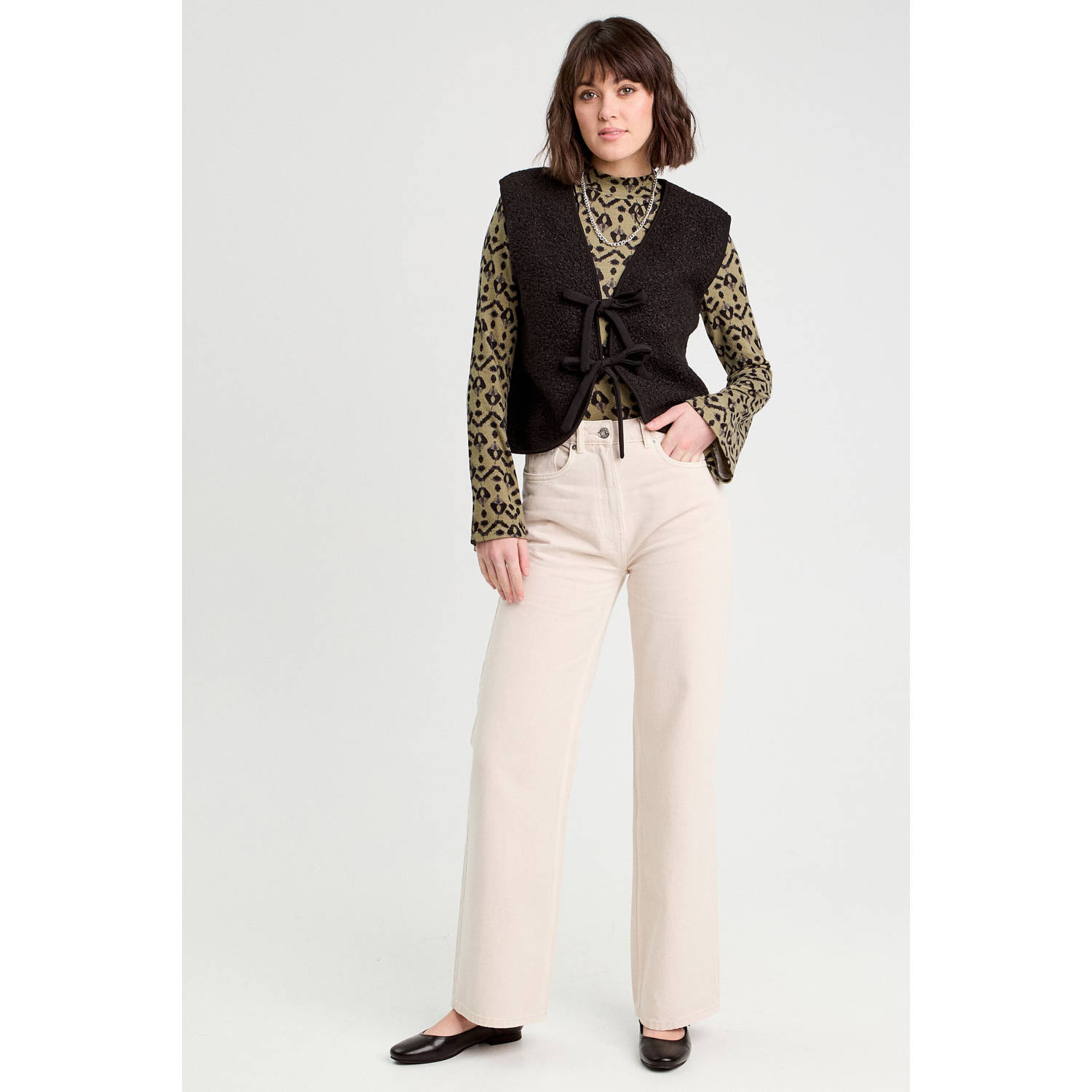 Cache teddy gilet zwart