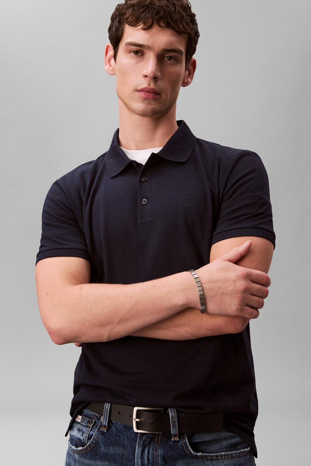 Donkerblauwe heren CALVIN KLEIN JEANS regular polo van katoen met effen, korte mouwen en pique