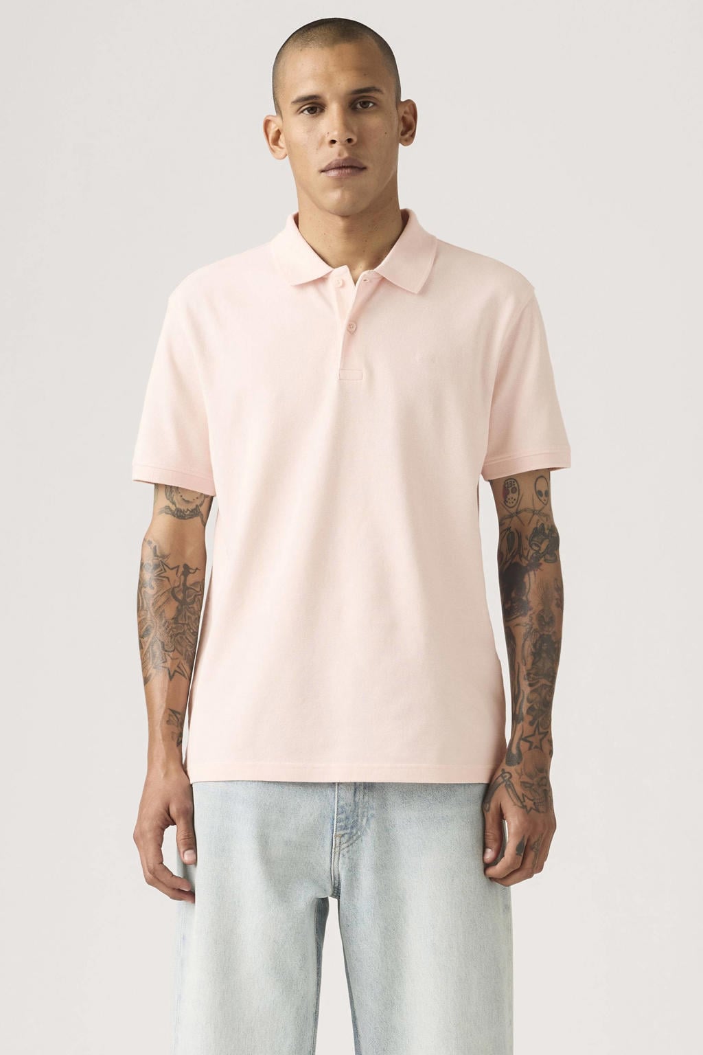 Lichtroze heren Levi's regular polo van katoen met effen, korte mouwen, knoopsluiting en pique