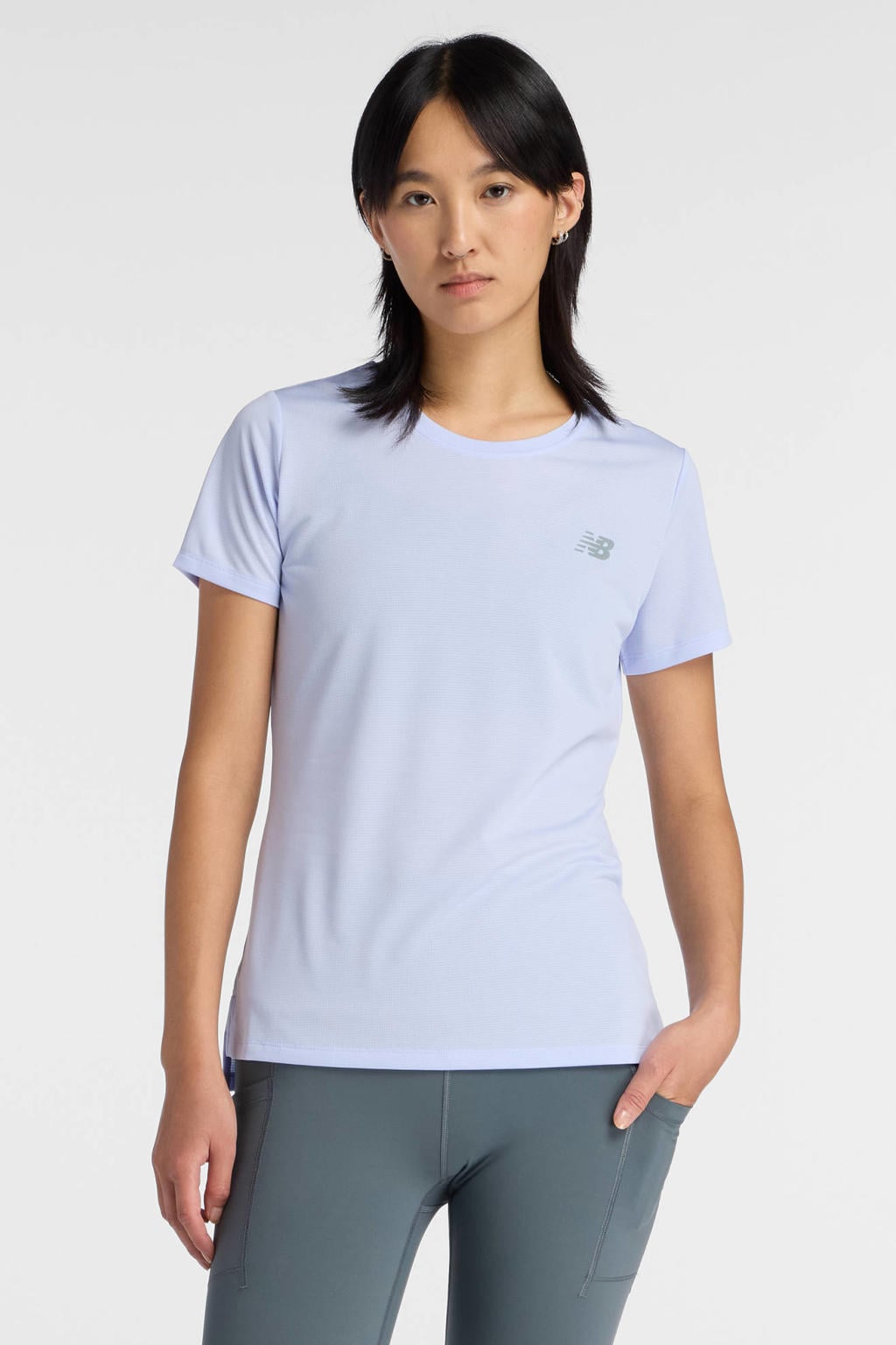 Lichtblauwe dames New Balance sportshirt van polyester met effen, korte mouwen en ronde hals