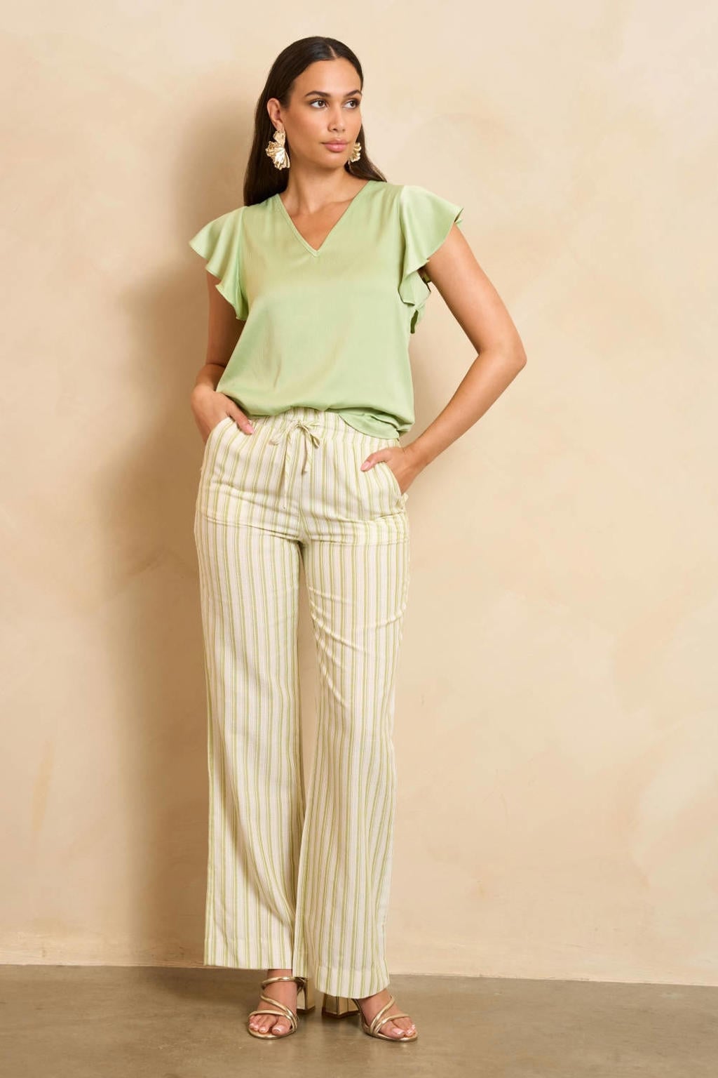 Mintgroene dames Lofty Manner top van polyester met effen, korte mouwen en V-hals