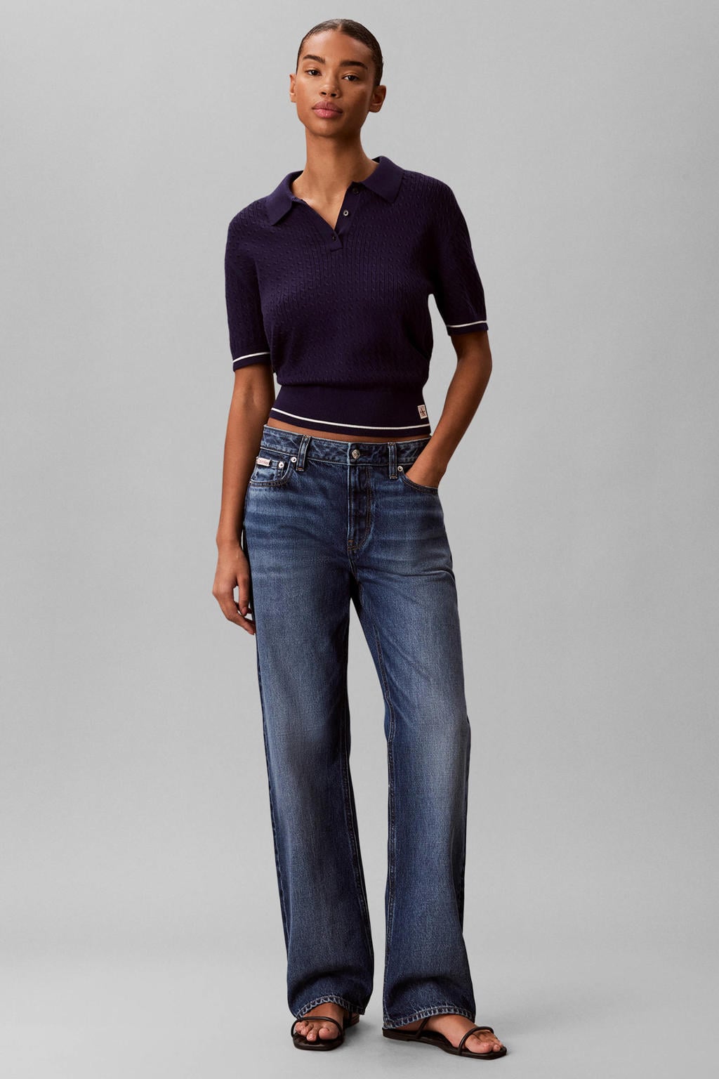 Donkerblauwe dames CALVIN KLEIN JEANS cropped top met effen, korte mouwen, polo kraag en kabel details