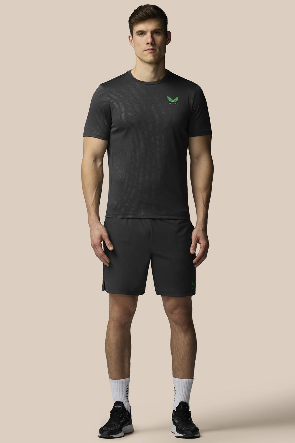 Grijs en groene heren Castore short van polyester met loose fit en effen