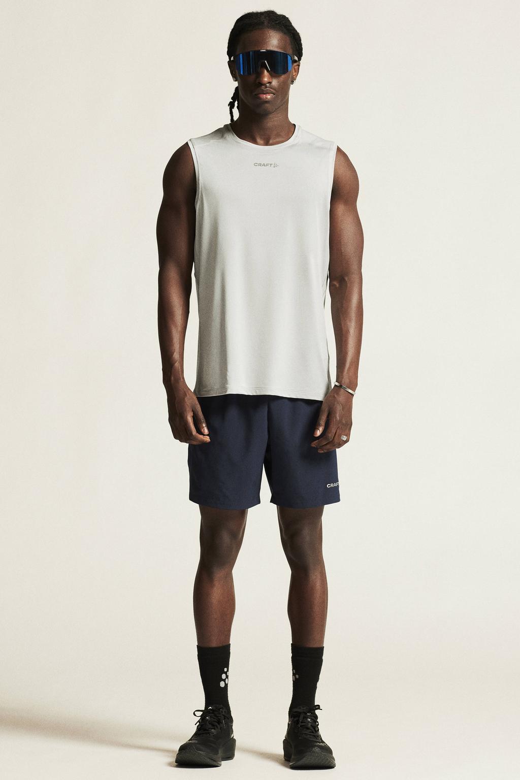 Lichtgrijze heren Craft Essence sportsinglet van polyester met ronde hals