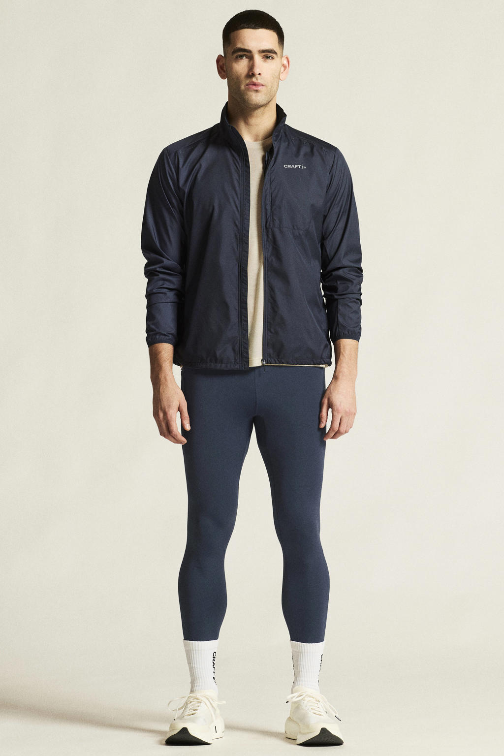 Donkerblauwe heren Craft ADV Essence hardloopjack van polyamide met effen en lange mouwen