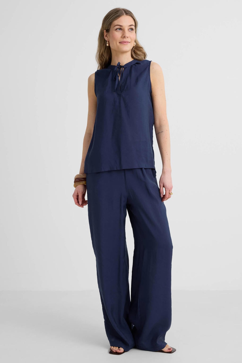 Marineblauw dames Anytime blousetop van polyester met effen en V-hals