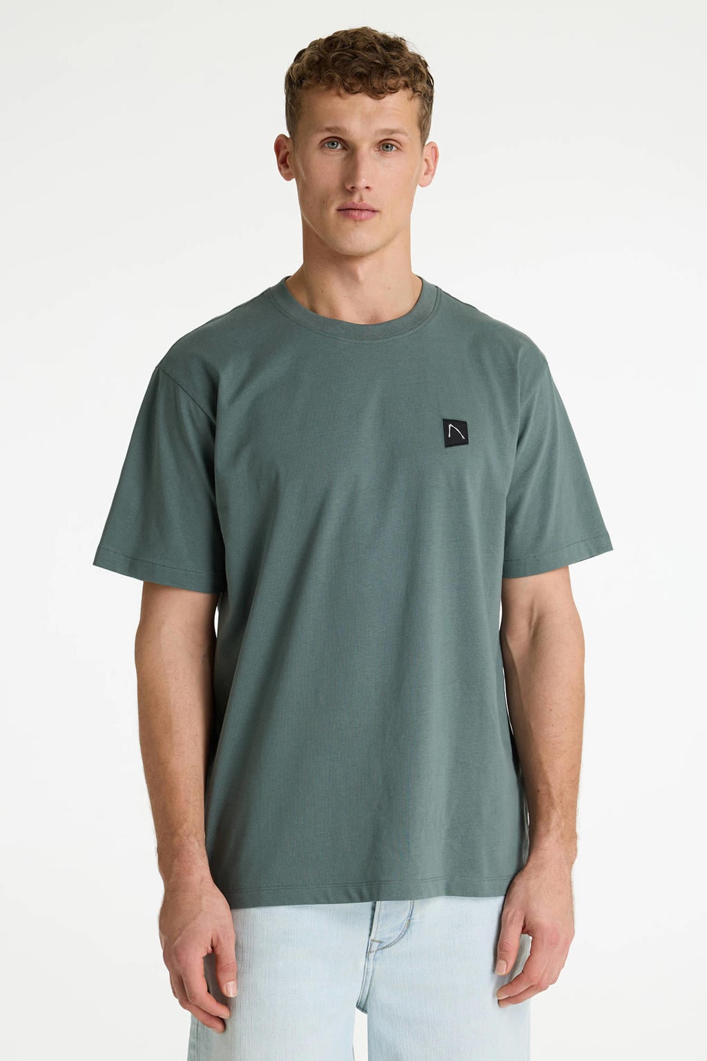 Donkergroene heren CHASIN' oversized T-shirt van katoen met backprint, korte mouwen en ronde hals