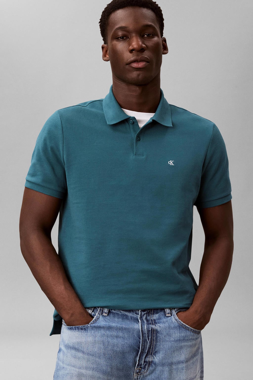 Petrolkleurige heren CALVIN KLEIN JEANS regular polo van katoen met effen, korte mouwen, knoopsluiting en pique