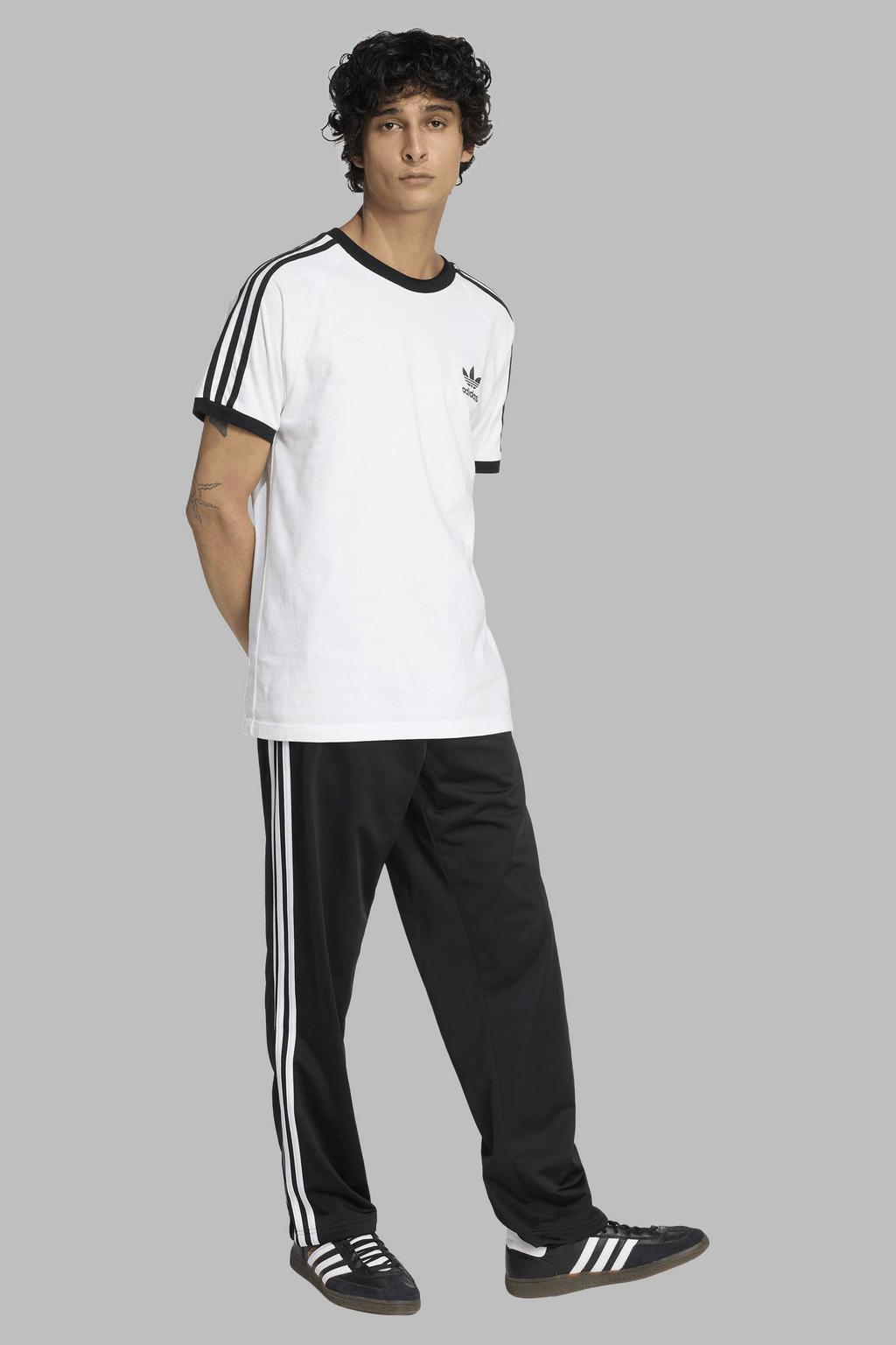 Zwart en witte heren adidas Originals Firebird trainingsbroek van polyester met loose fit, elastische tailleband met koord en effen