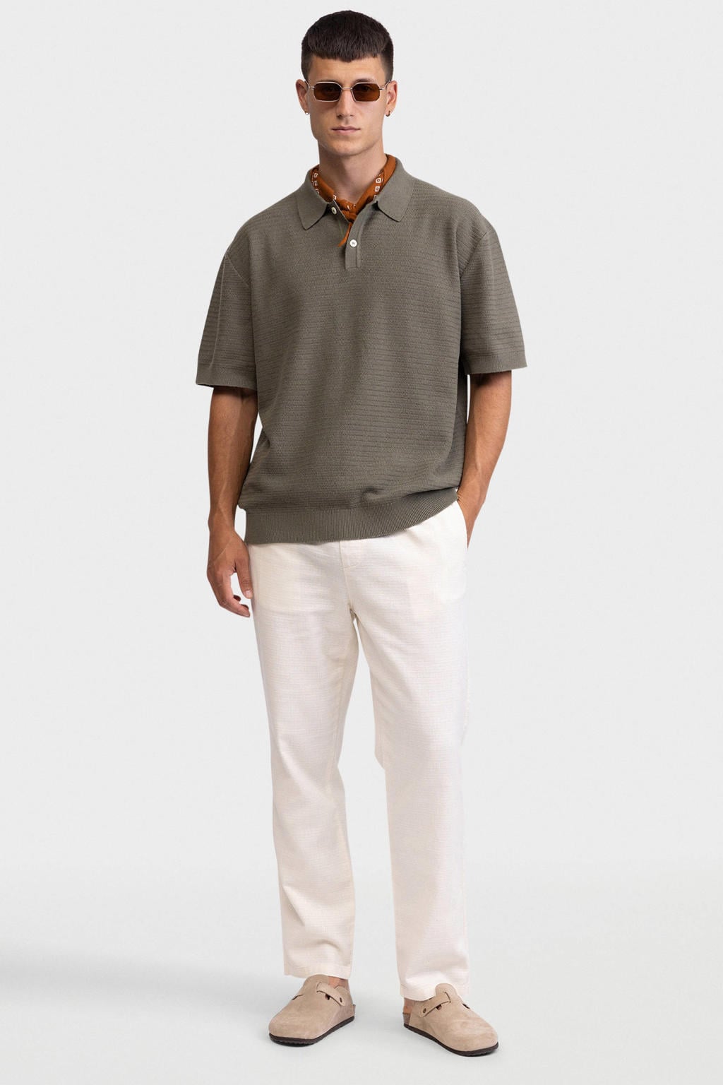 Groene heren Redefined Rebel relaxed polo gebreid van katoen met effen, korte mouwen en knoopsluiting