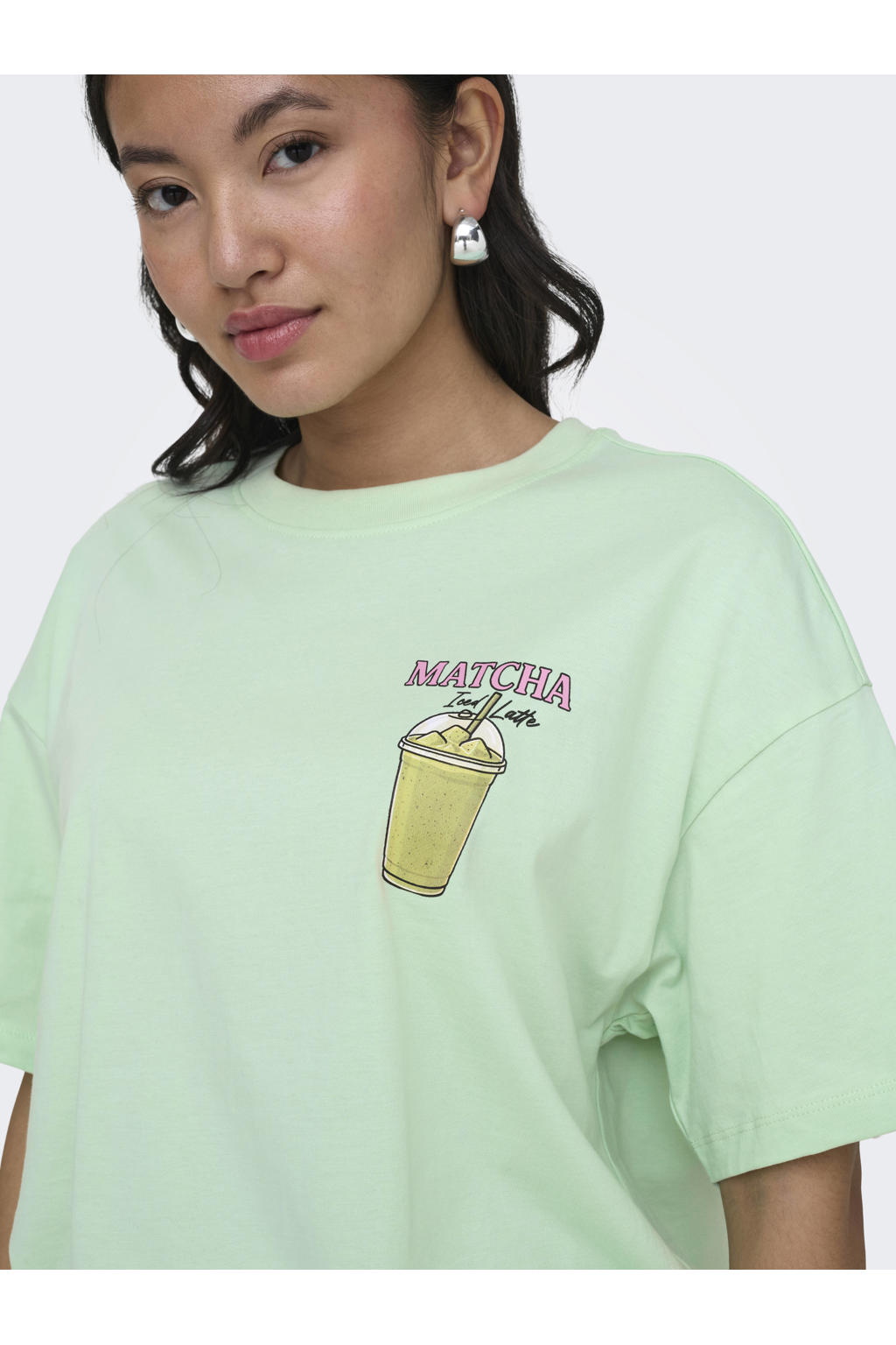 Lichtgroene dames ONLY T-shirt van katoen met backprint, korte mouwen en ronde hals