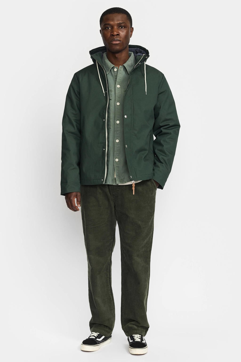 Donkergroene heren REVOLUTION parka van polyester met effen, lange mouwen, capuchon, rits- en knoopsluiting en tunnelkoord