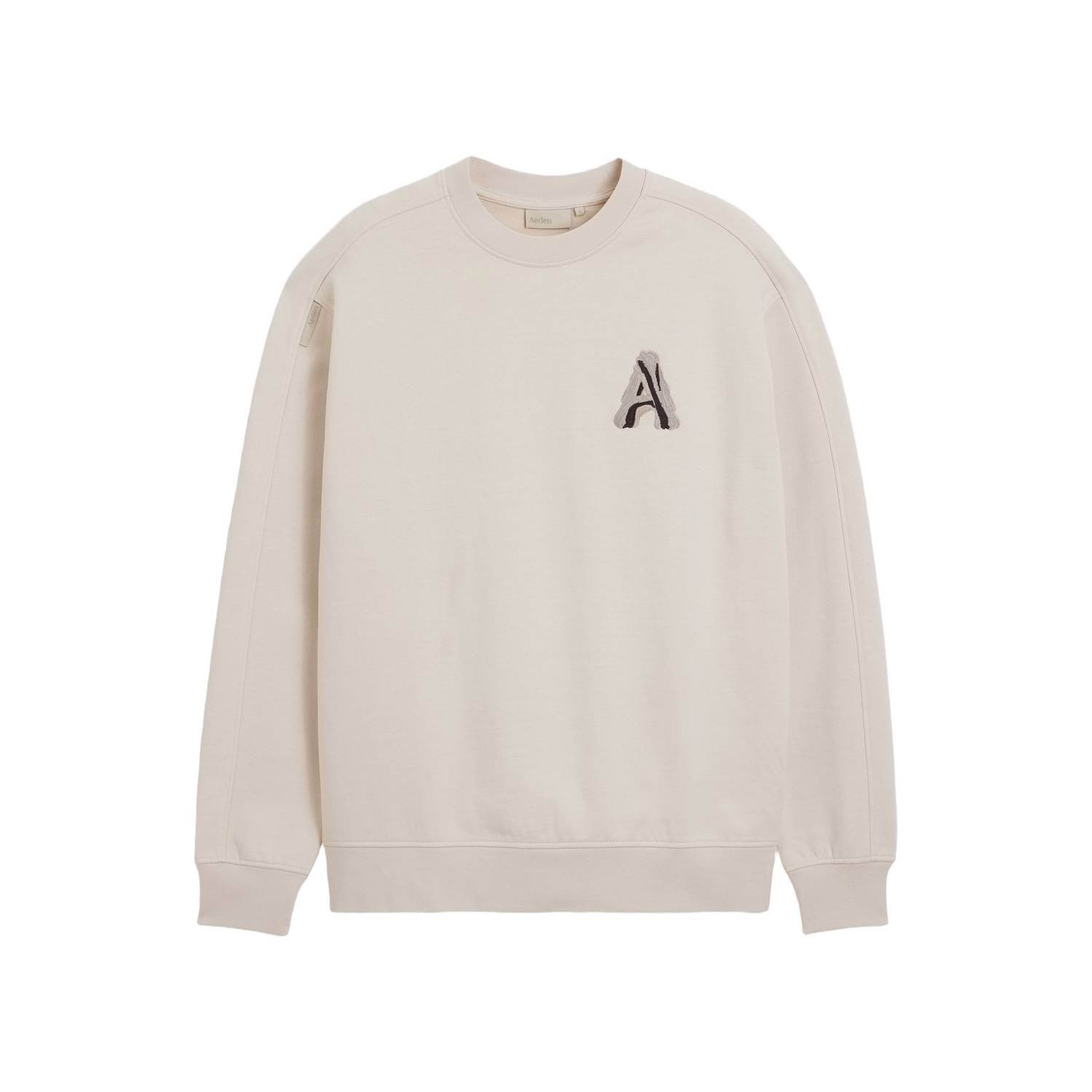 Aeden oversized trui met borduursels en backprint beige
