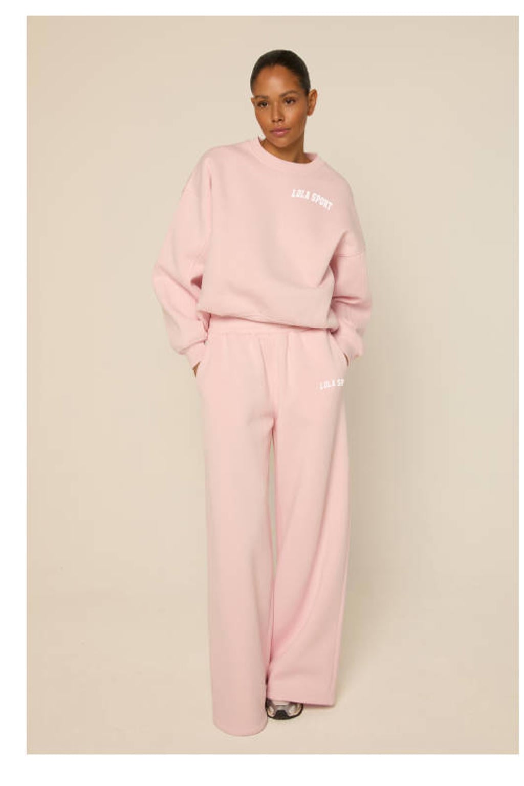 Lichtroze dames The Lola Club sweater met effen, lange mouwen en ronde hals