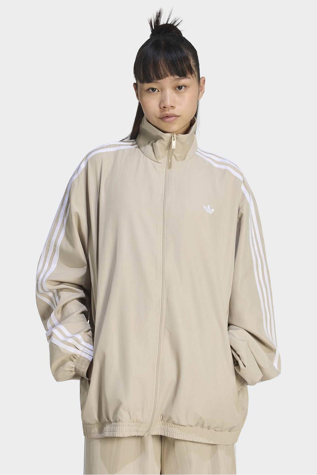 Zandkleurige dames adidas Originals Firebird Adilenium vest met effen, lange mouwen, opstaande kraag en ritssluiting