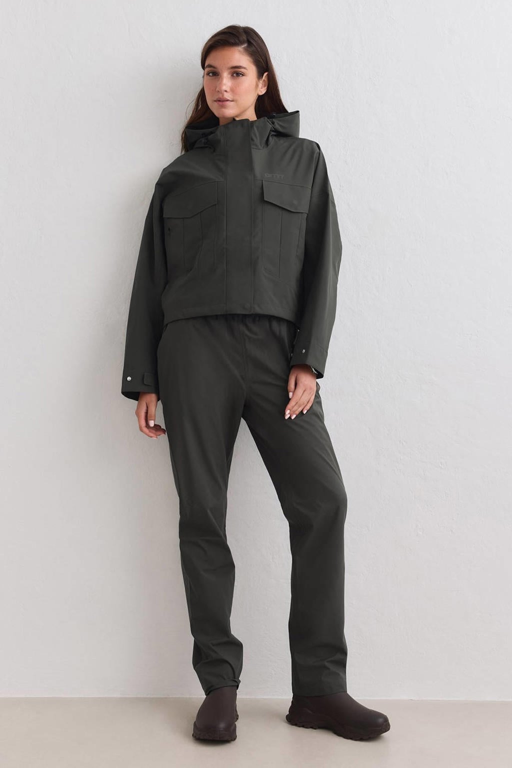 Donkergroene dames Aim'n sportjack van polyester met lange mouwen, capuchon en ritssluiting