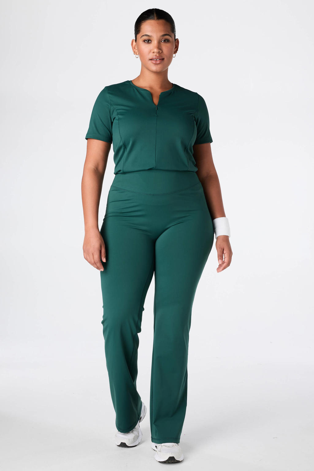 Donkergroene dames MS Mode sportlegging met flared pijpen, high waist, elastische tailleband en effen