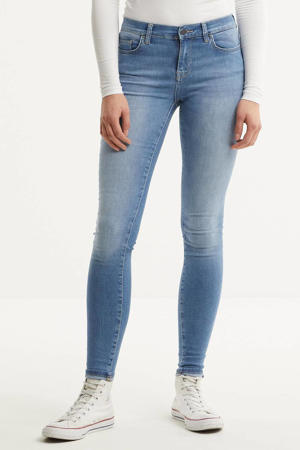 skinny jeans met regular waist