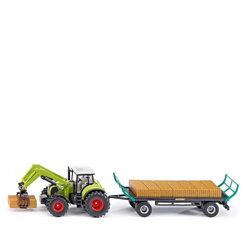 Mayka tractor met balengrijper en aanhanger